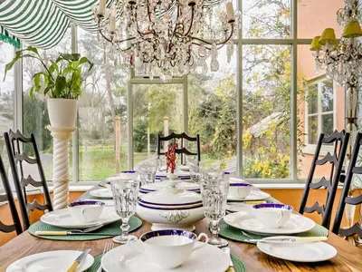 a dining room with a table with a chandelier at 4 Bed in Eye- oc-34389 in Thornham Magna