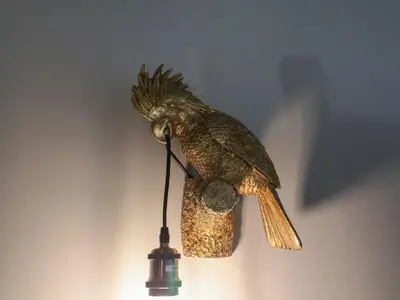 a statue of a bird on a wall at The Corn Silo in Ipswich