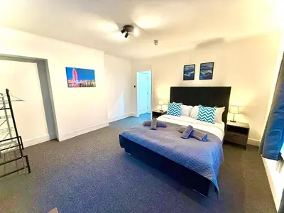 a bedroom with a bed and a ladder in it at Sleep Hub in Leiston