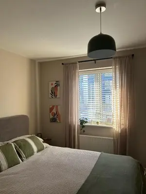a bedroom with a large bed and a window at 1 bed flat close to Chelmsford City Centre in Chelmsford