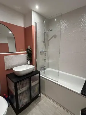 a bathroom with a shower and a sink and a tub at 1 bed flat close to Chelmsford City Centre in Chelmsford