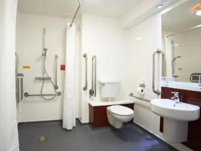 a bathroom with a toilet and a sink and a shower at Travelodge Ipswich in Ipswich