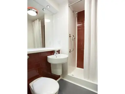 a bathroom with a toilet and a sink and a shower at Travelodge Ipswich in Ipswich
