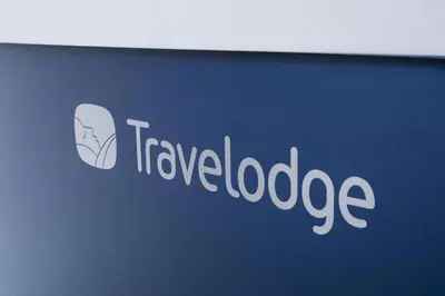 a sign with the words travel lookedage on it at Travelodge Harlow in Harlow