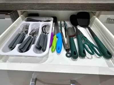 a drawer filled with utensils in a cabinet at The old greengrocers Battlesbridge in Rawreth