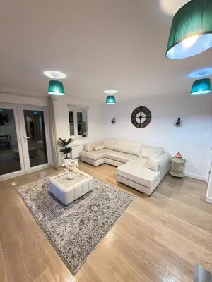 a living room with two white couches and a rug at Oak House No15 Scotland Road 5BR Parking in Chesterton