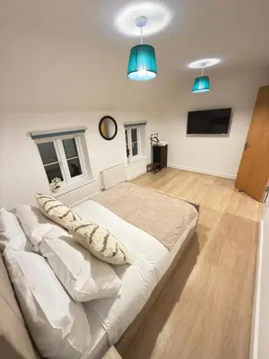a large bed in a room with blue lights at Oak House No15 Scotland Road 5BR Parking in Chesterton
