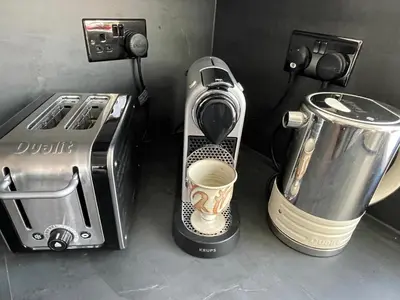 a coffee maker next to a toaster and a coffee maker at Cozy Organic Tea House in Central Ipswich near Waterfront, University and Hospital in Ipswich