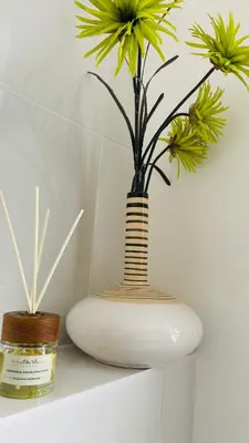 a white vase with a plant on a shelf at Cozy Organic Tea House in Central Ipswich near Waterfront, University and Hospital in Ipswich