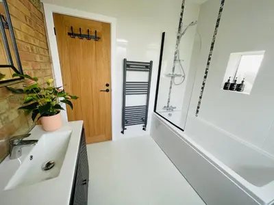 a bathroom with a sink and a shower and a tub at Cozy Organic Tea House in Central Ipswich near Waterfront, University and Hospital in Ipswich
