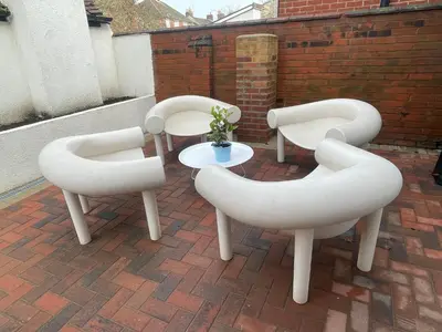 four white chairs and a table on a patio at Cozy Organic Tea House in Central Ipswich near Waterfront, University and Hospital in Ipswich