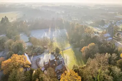 an aerial view of a house in a field at Bressingham Lodge by Leap Escapes in Diss