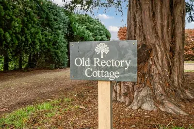 a sign in front of an old registry courthouse at Old Rectory Cottage, Tostock in Tostock