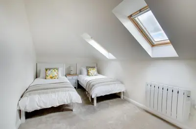 a attic bedroom with two beds and a skylight at 2 Bed in Newton oc-ffba in Newton