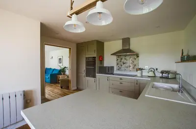 a kitchen with white cabinets and a counter top at 2 Bed in Newton oc-ffba in Newton
