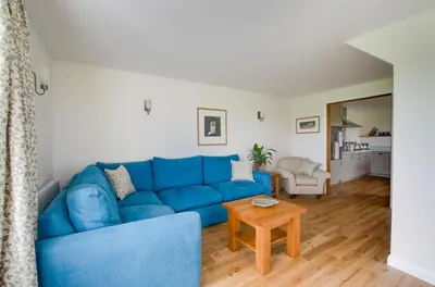 a blue couch in a living room with a table at 2 Bed in Newton oc-ffba in Newton