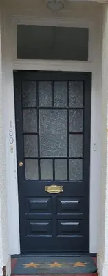 a black door with a window on a house at Happy house in Southend-on-Sea