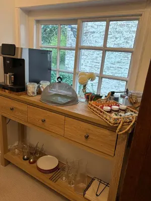 a wooden counter with a microwave and a window at 7 The Quay in St Ives