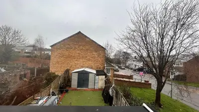 a small house with a window on the side of it at Cozy Guest Room in Basildon with Shared Facilities in Basildon