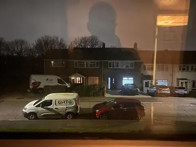 a house on fire with cars parked in front of it at Serene Guest Room Retreat in Basildon with Private Entrance in Basildon