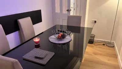a table with a bowl of food and a candle on it at Serene Guest Room Retreat in Basildon with Private Entrance in Basildon