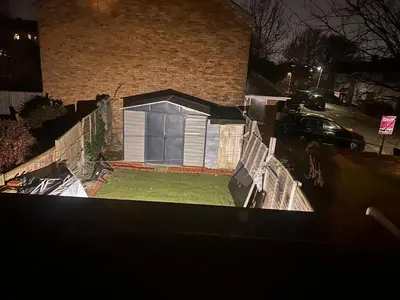 a house with a garage in a yard at Charming 4-Bedroom House Rental in Basildon, UK in Basildon