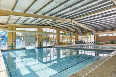 an indoor swimming pool with a large pool at Caravan in Clacton-on-Sea in Little Clacton