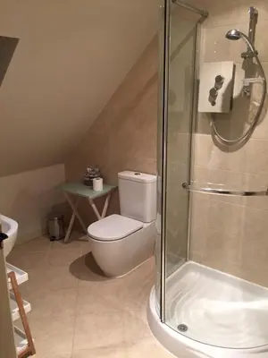 a bathroom with a toilet and a glass shower at Idyllic rural retreat, easy access to Cambridge