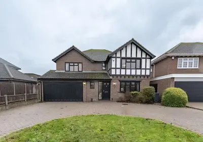 a large brick house with a garage at Tudor Style Seafront Home Sea Views Shoebury - Pass the Keys in Southend-on-Sea