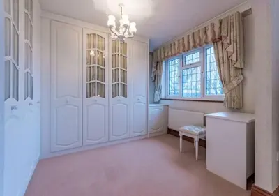 a white room with a table and a window at Tudor Style Seafront Home Sea Views Shoebury - Pass the Keys in Southend-on-Sea