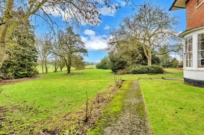 a view of the garden from the side of a house at Finest Retreats - Clavering Hall in Saffron Walden
