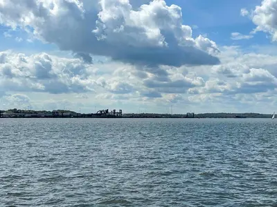 a large body of water under a cloudy sky at Admiralty Lodge in Shotley Gate