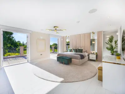 a bedroom with a bed and a living room at The Essex Mansion - Uk48355 in Romford