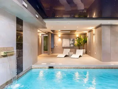 a swimming pool in a building with a house at The Essex Mansion - Uk48355 in Romford