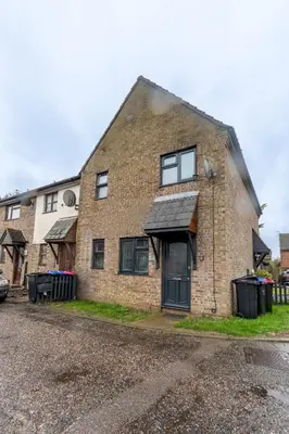 an old brick house with a black door at A lovely modern comfortable one bedroom house - Pass the Keys in Southend-on-Sea