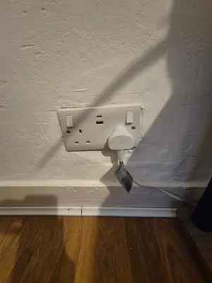 a light on the corner of a white wall at Stoke house in Ipswich