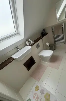 a bathroom with a sink and a toilet at Modern Suite with a Queen Bed, Ensuite & Workspace in Chelmsford