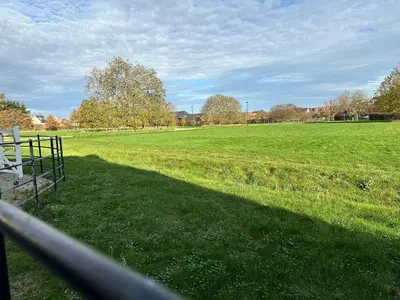 a view of a field from a fence at Modern Suite with a Queen Bed, Ensuite & Workspace in Chelmsford