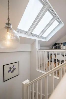 a skylight in a living room with a staircase at Charming Central 1Bed Home in Chesterton