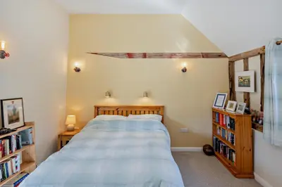 a bedroom with a bed and a book shelf at 6 Bed in Ardleigh oc-b35089 in Ardleigh