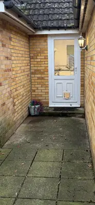 a white door with a window in a brick wall at The Wright One Bedroom Place To Stay in Kingsgate