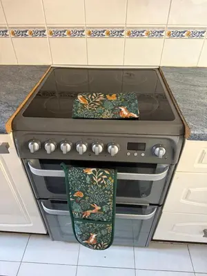 a stove with two towels sitting on top of it at The Wright One Bedroom Place To Stay in Kingsgate