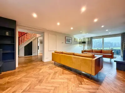 a large living room with a couch and a television at Charming 6BDR home in the Essex Countryside in Stanford Rivers