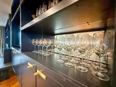 a row of wine glasses sitting on a counter at Charming 6BDR home in the Essex Countryside in Stanford Rivers