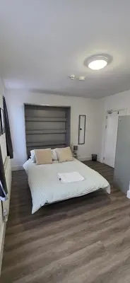 a bedroom with a large bed in a room at Great En-suite room, room 4 in Ipswich