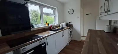a kitchen with a counter top and a window at Comfy 1 bed in the idyllic village of Hemingford Grey in Hemingford Grey
