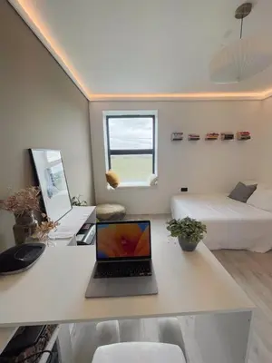 a laptop computer sitting on a desk in a room at Luxurious Retreat with Cinema Lounge in Ely