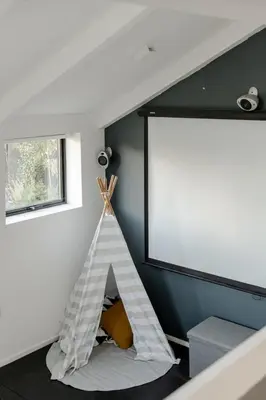 a room with a white dog house in the corner at Luxurious Retreat with Cinema Lounge in Ely