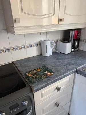 a kitchen counter with a stove and a microwave at The Wright 1 bedroom place to stay large drive in East Harling