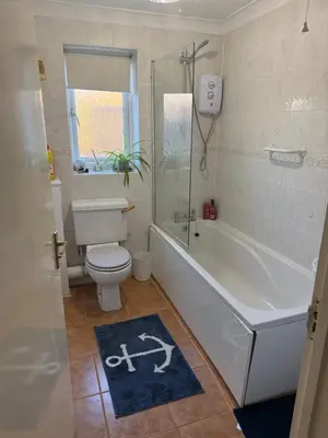 a bathroom with a tub and a toilet and a shower at The Wright 1 bedroom place to stay large drive in East Harling